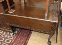 A 1920's George I style mahogany drop leaf extending dining table 174cm extended (one spare leaf)