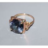 A yellow metal and synthetic colour change corundum set dress ring, size L.