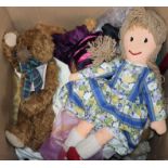 A collection of dolls and teddy bears