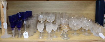 A collection of table glassware, including a part suite of cut crystal drinking glasses with faceted