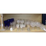 A collection of table glassware, including a part suite of cut crystal drinking glasses with faceted