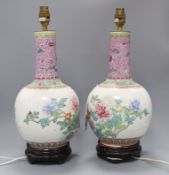 A pair of Chinese bottle-shaped vase table lamps, decorated with flowers in polychrome enamels