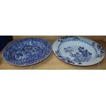 Two Chinese blue and white bowls, 18th/19th century, one with all-over floral and foliate design,