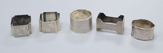 A pair of George V Art Deco silver napkin rings by Walker & Hall, Sheffield, 1935 and three other