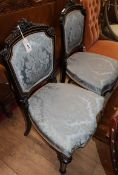 A pair of Victorian ebonised and gilt side chairs