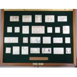 A cased set of sterling replica stamp ingots 'The Stamps of Royalty', case 35.2cm.