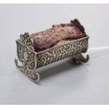 A late Victorian novelty repousse silver mounted cradle pin cushion, Saunders & Shepherd,