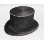 A leather top hat, boxed interior measurement 20 x 16cm