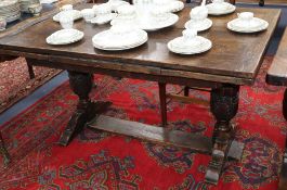 A 17th century style oak draw leaf dining table 210cm extended