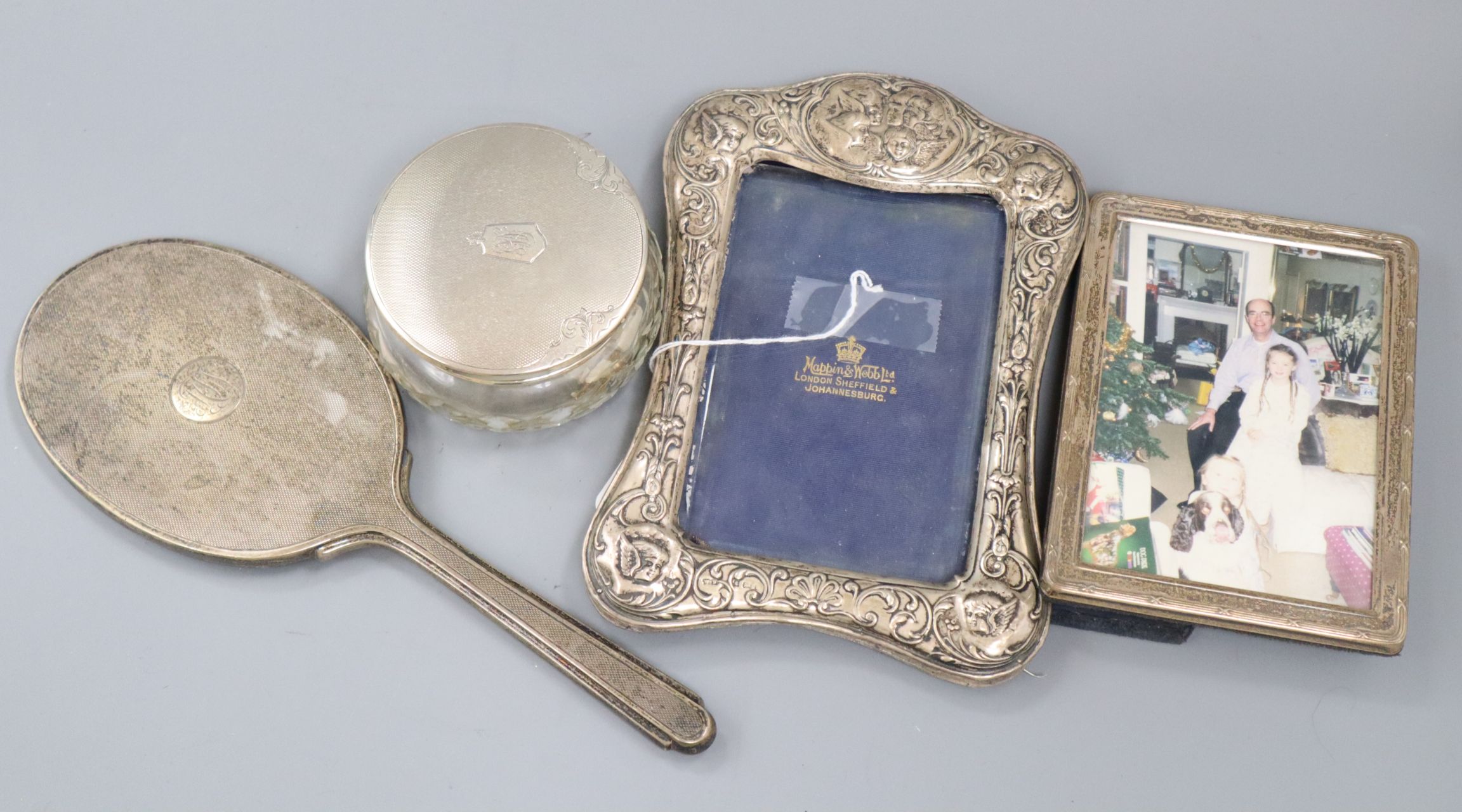 Two silver photograph frames, including early 20th century with Reynold's Angels, a silver mounted