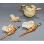 A Clarice Cliff harvest pattern teapot and three Beswick flying pheasants