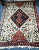 A Persian ivory ground rug 125 x 175cm