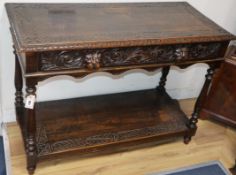 A 1920's carved oak hall table W.106cm