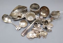 A group of assorted small silver and plated items including caddy spoons, napkin rings, thimbles,