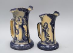 Two graduated Royal Doulton Morrisian ware jugs, c.1900, decorated with dancing ladies and