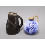 A Royal Doulton 'Blue Lady' jug and a Doulton Black Leather ware jug, with silver mounted rim