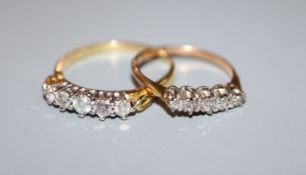 A modern 18ct gold and five stone diamond half hoop ring and one other yellow metal and five stone