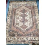 A Turkish red ground rug 120 x 170cm