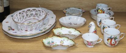 A collection of Herend porcelain tableware, including two oval serving dishes, one decorated with