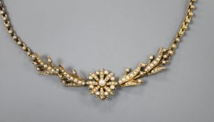 A late Victorian yellow metal and seed pearl necklace (lacking drop pendant), 38cm.