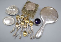 A silver mounted inkwell, continental tea spoons, silver hand mirror, silver pin dishes and a silver