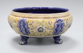 A Doulton Lambeth three legged bowl by Frank A Butler, dated 1883, incised with tracery designs,