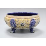 A Doulton Lambeth three legged bowl by Frank A Butler, dated 1883, incised with tracery designs,