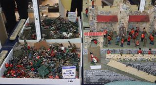 A quantity of Britains and other diecast military figures with fort.