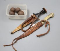 Two Eastern daggers and four canon balls