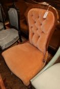 A Victorian mahogany framed spoonback chair, upholstered in buttoned pink dralon