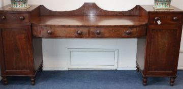 A George IV mahogany pedestal sideboard W.243cm