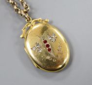 A 9ct back and front paste set oval locket, on an Edwardian 9ct chain.