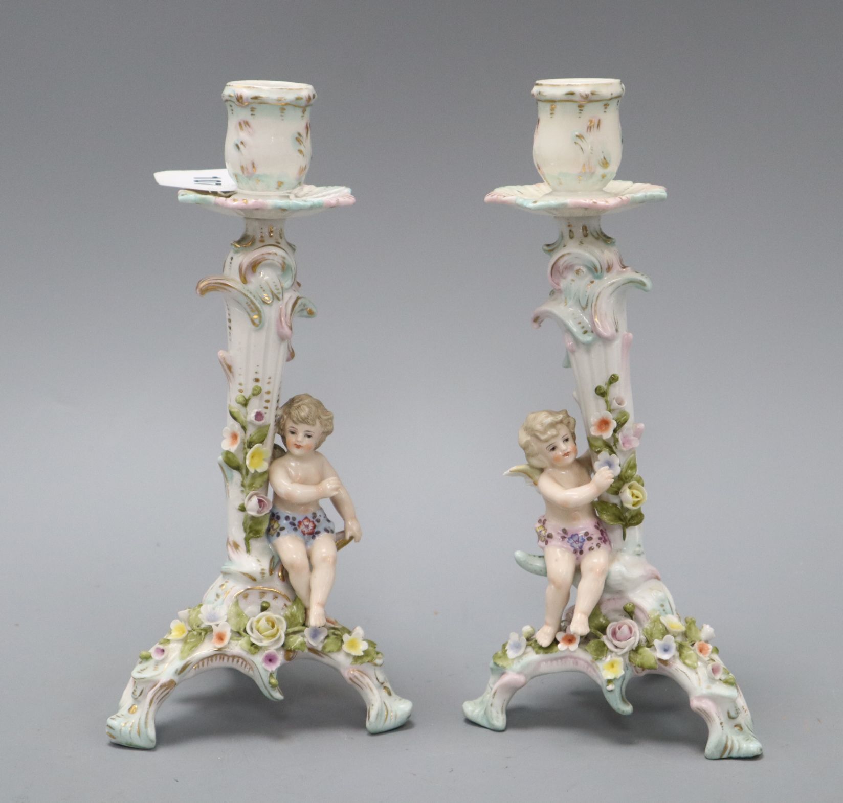 A pair of Sitzendof figural candlesticks H.23cm
