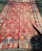 A Turkish red Kelim rug 345 x 200cm