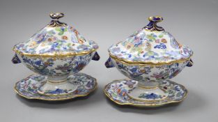 A pair of Victorian ironstone sauce tureens and stands H.18cm