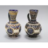 Two similar Doulton Lambeth incised and beaded jugs, assistant's marks GP and AB