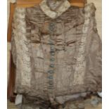 A Victorian satin and lace lady's blouse in a leather case