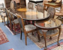 A 1930's walnut dining suite - table, eight chairs and a side table Table L.224cm