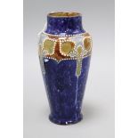 A Royal Doulton stoneware vase by Frank A. Butler, c.1905, height 20cm