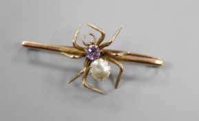 An early to mid 20th century yellow metal, amethyst and mother of pearl set 'spider' bar brooch,