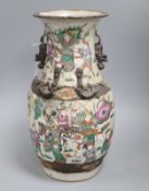 A Cantonese two handled vase, painted with warriors H.35cm