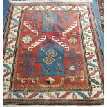 A Caucasian red ground rug 120 x 130cm