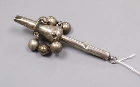 A late 19th century Chinese white metal child's rattle by Tien Shing?, Hong Kong, 11cm.