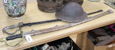 Two swords and a helmet Longest sword 107cm