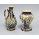 A Doulton Lambeth leaf incised jug, dated 1877, by Elizabeth A Gadson & Fanny Clark and a similar