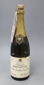 A bottle of Bollinger extra quality very dry Champagne