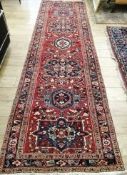 A Karajah red ground runner 105 x 370cm