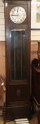 A 1920's oak cased eight day striking and chiming longcase clock H.214cm