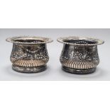 A pair of silver-plated coasters with deep pierced borders H.11cm, 17cm diameter