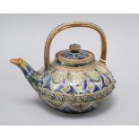 A Doulton Lambeth compressed globular teapot and cover, by Louisa E Edwards, dated 1877, assistant's